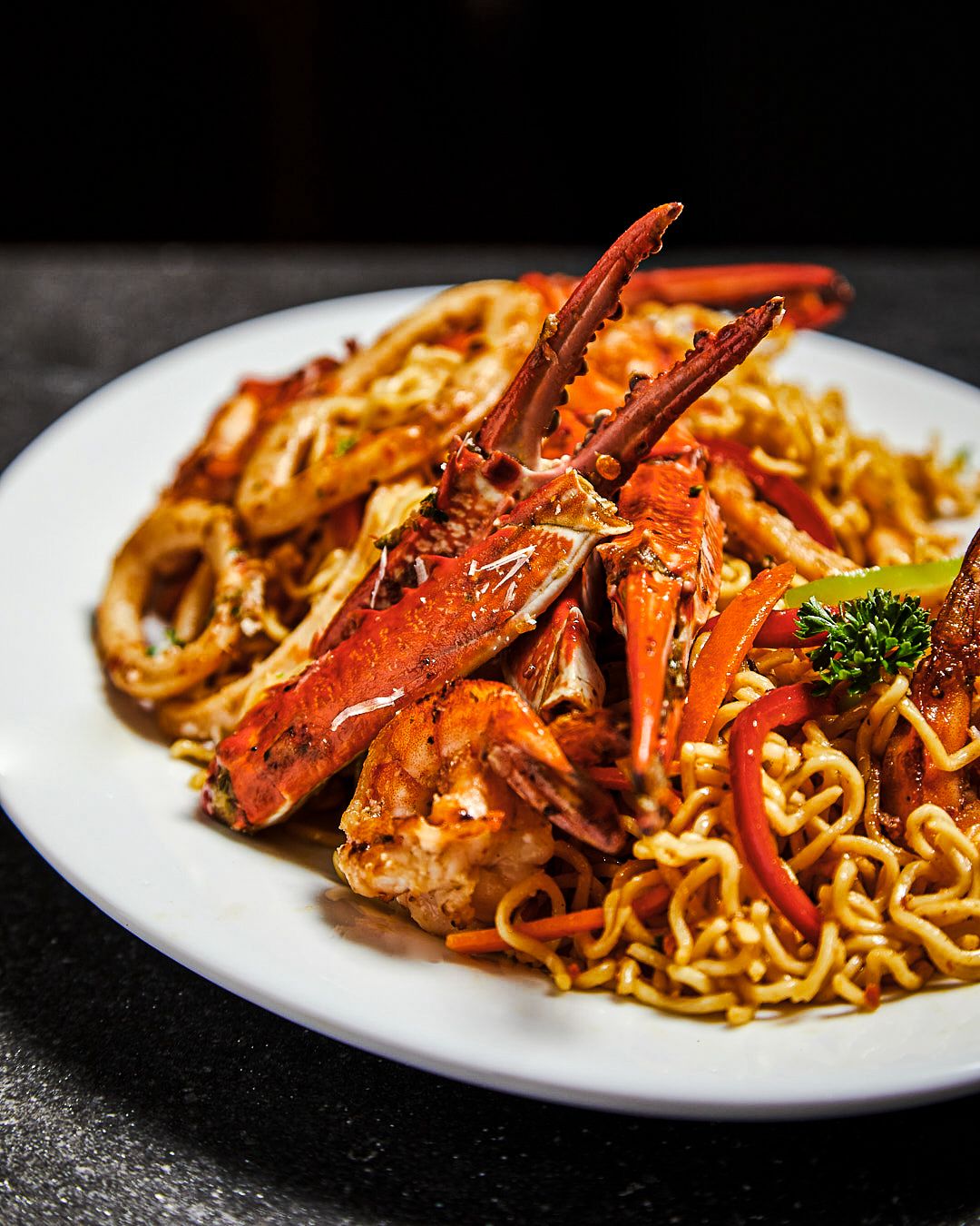 Seafood noodles with prawns, calamari and vegetables in a light sauce